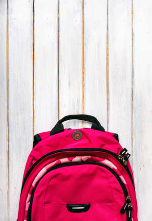 Series on weathered wood background with school items, as well as face masks and hand sanitizer for back to school.の写真素材