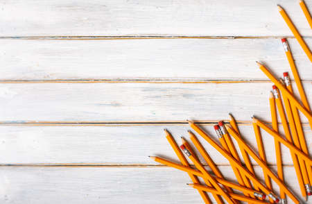 Series on weathered wood background with school items, as well as face masks and hand sanitizer for back to school.の写真素材