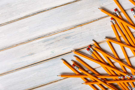Series on weathered wood background with school items, as well as face masks and hand sanitizer for back to school.の写真素材