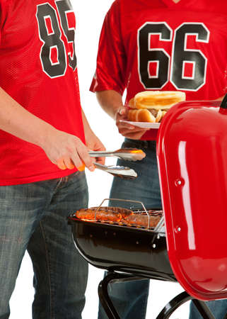Extensive series, of male and female fans of American football.  Watching from a couch, tailgating, and more...の写真素材