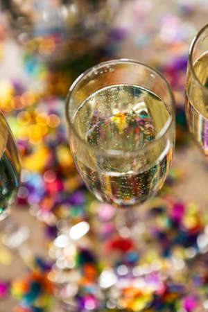 Colorful series with confetti, party favors and champagne.の写真素材