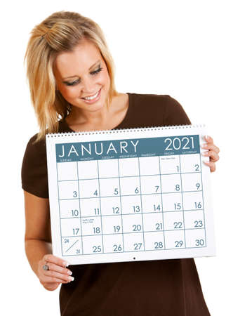 Cute series with a Caucasian woman holding a calendar for different times of the year.の写真素材