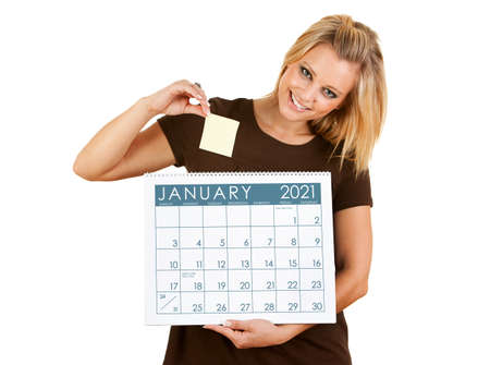 Cute series with a Caucasian woman holding a calendar for different times of the year.の写真素材