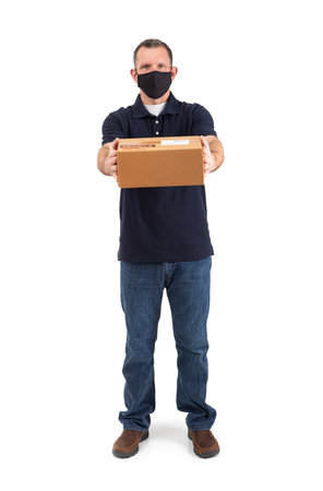 Adult male wearing a face mask during the Covid pandemic, isolated on white.の写真素材