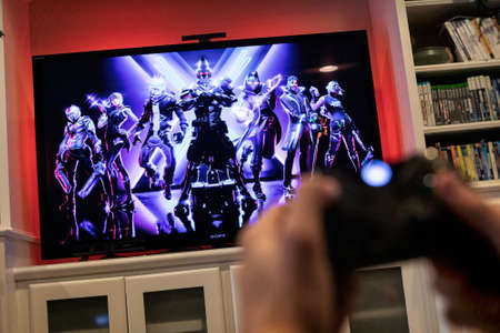 Modern, popular media and games being viewed on a large screen television through an Xbox One.のeditorial素材
