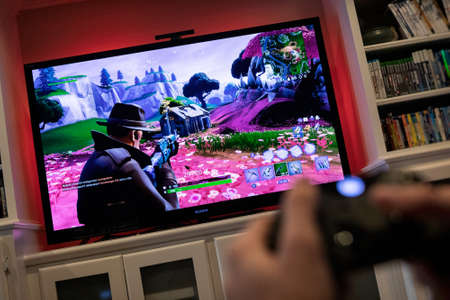 Modern popular media on a large screen television.のeditorial素材