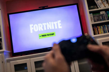 Modern, popular media and games being viewed on a large screen television through an Xbox One.のeditorial素材