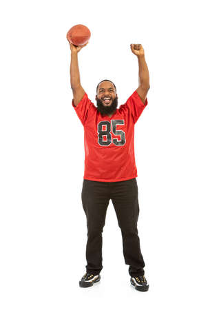 An African American man in a football team jersey in various poses.の写真素材