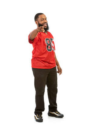 An African American man in a football team jersey in various poses.の写真素材