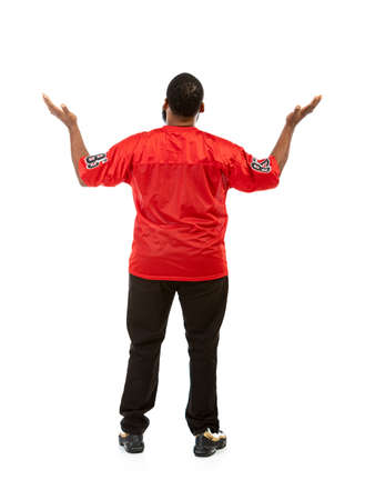 An African American man in a football team jersey in various poses.の写真素材