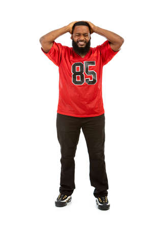 An African American man in a football team jersey in various poses.の写真素材