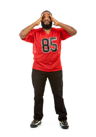 An African American man in a football team jersey in various poses.の写真素材