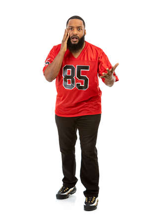 An African American man in a football team jersey in various poses.の写真素材