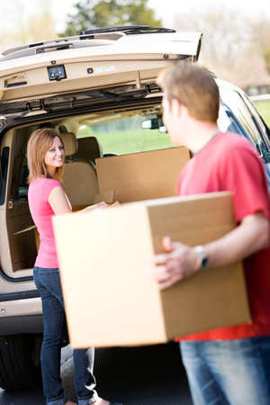 Caucasian man and woman with various props at a typical commercial storage unit.の写真素材
