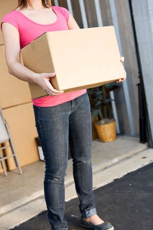 Caucasian man and woman with various props at a typical commercial storage unit.の写真素材