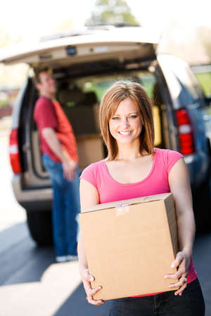 Caucasian man and woman with various props at a typical commercial storage unit.の写真素材