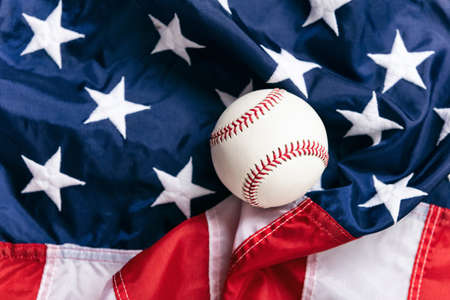 Image with copyspace, good for baseball or summer themed design and advertising. Includes American flag.の写真素材