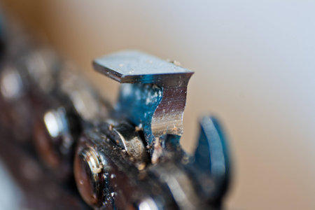 Close up of a sharp chainsaw tooth.の写真素材