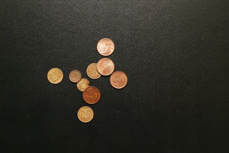 Some coins on a black suitcaseの写真素材
