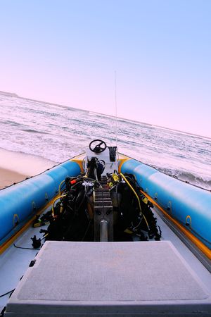 Dive boat lying on the beach, waiting for diversの写真素材