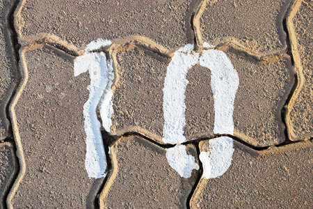 Number ten paintend on pavementの写真素材