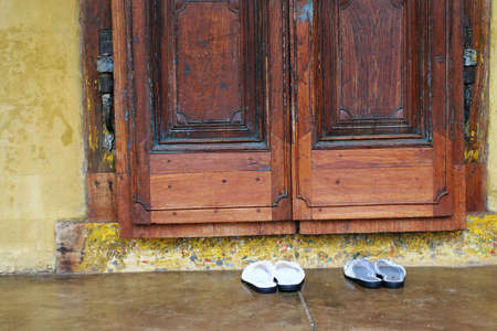 slipper standing outside the doorの写真素材