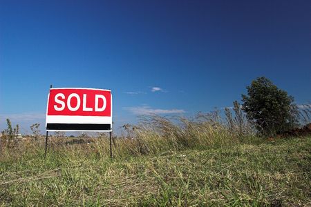 Red sign against blue skyの写真素材