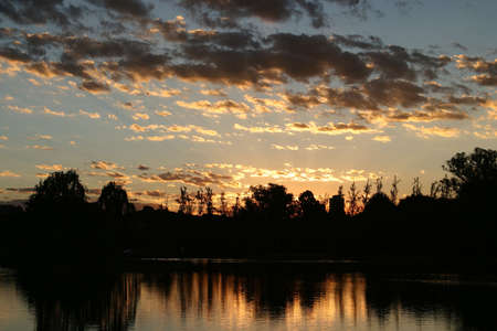 Sunset over waterの写真素材