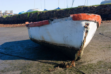 Derelict boat next to the water - Knysna Harbour, South Africa