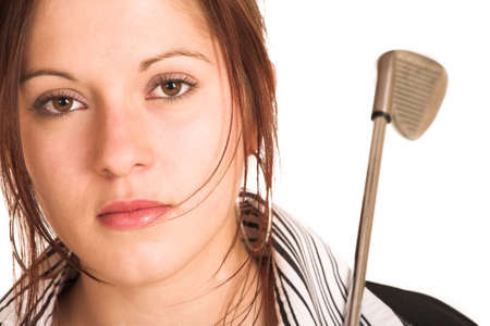 Business woman with brown hair, dressed in a white shirt with black stripes. Holding a  golf putter.  Copy spaceの写真素材