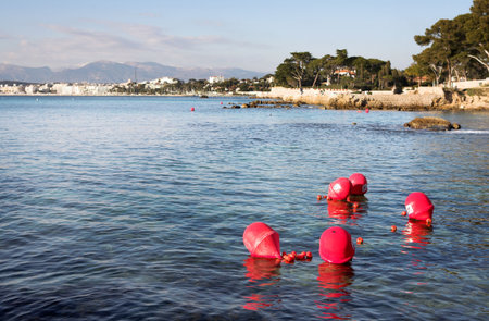 Buoys floating on the ocean in Antibes, France - NO DIVING. Copy space.の写真素材
