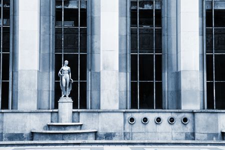 An old building with golden statues in Paris, France.  Blue tone.の写真素材