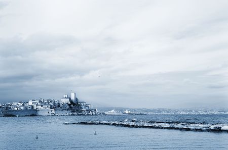 A town overlooking the sea in Antibes, France.  Blue tone.  Copy space.の写真素材
