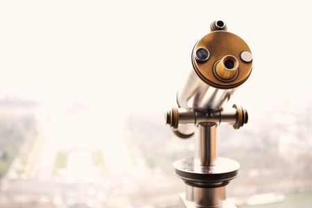 Pay Telescope on the second level of the Eiffel Tower looking out over the Champs de Mars  Shallow DOF  Gloomy winters day, background out of focus. copy space.の写真素材