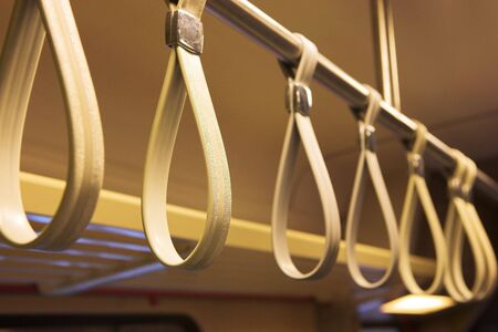Handles on a bus.の写真素材