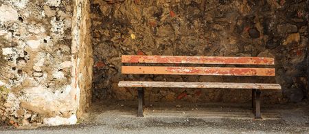 Old bench in the Original Harbour blocking wall at Baie Des Anges in Antibes, France.  Copy space.の写真素材
