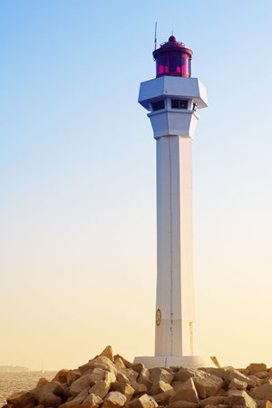 The lighthouse at the edge of the harbor (Port Le Vieux) in Cannes, Franceの写真素材