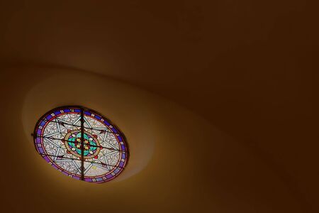 Stained glass window close to the roof inside a chapelのeditorial素材