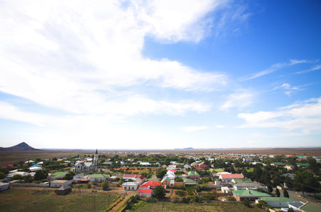 Blue sky with dramatic clouds over a desert town landscape, Hanover, South Africa