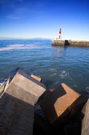 Big cement blocks (doloses) for storm water break outside the harbour wall, Kalkbay, Western Cape, South Africa の写真素材