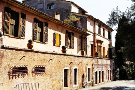 Buildings with windows and doors in the quaint little French hilltop village of Saint-Paul de Vence, Southern France,  Alpes Maritimes, next to the Mediterranean sea - A Heritage Siteの写真素材