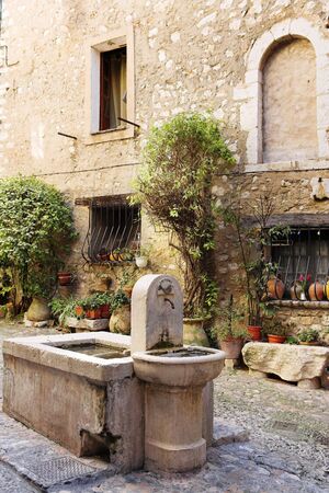 Fresh water fountain in the centre of the quaint little French hilltop village of Saint-Paul de Vence, Southern France, Alpes Maritimes, next to the Mediterranean sea - A Heritage Site Fresh water fountain in the centre of the quaint little French hilltop village of Saint-Paul de Vence, Southern France, Alpes Maritimes, next to the Mediterranean sea - A Heritage Site