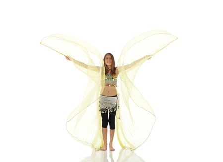 Young Caucasian belly dancing girl in beautiful decorated clothes on white background and reflective floor. Not isolatedの写真素材
