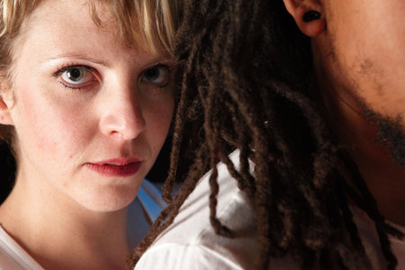 Portrait of male and female freestyle hip-hop dancers. Lit with spotlights