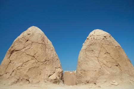 Rebuilt historic Fort Zubarah (Al Zubara) in North East of the deserts of Qatar on the edge of the Persian gulf on a sunny summer dayの写真素材