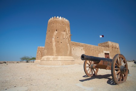 Rebuilt historic Fort Zubarah (Al Zubara) in North East of the deserts of Qatar on the edge of the Persian gulf on a sunny summer dayの写真素材