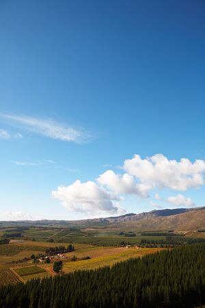 Landscape of the famous Franschhoek Valley wine region in the Western Cape of Southern Africa as seen from the top of the surrounding mountainsの写真素材