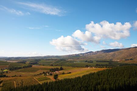 Landscape of the famous Franschhoek Valley wine region in the Western Cape of Southern Africa as seen from the top of the surrounding mountainsの写真素材