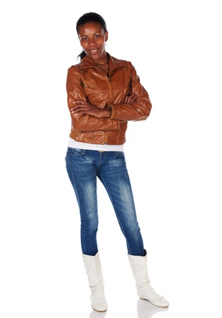 Beautiful black african young adult woman casually dressed in a brown leather jacketの写真素材