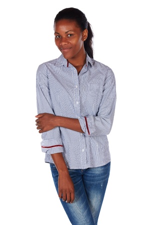 Pretty black african young adult businesswoman casually dressed in a blue pinstripe office shirtの写真素材